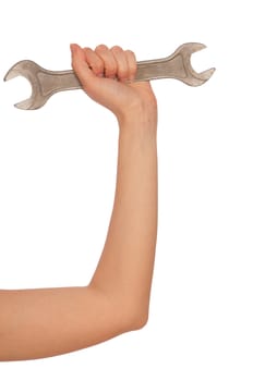 woman holds a big spanner in the hand
