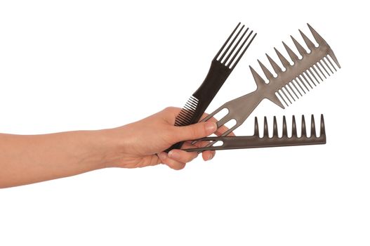 hairdresser holds the black tools for haircut