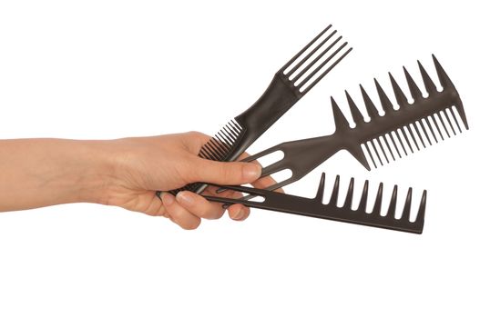 hairdresser holds the black tools for haircut