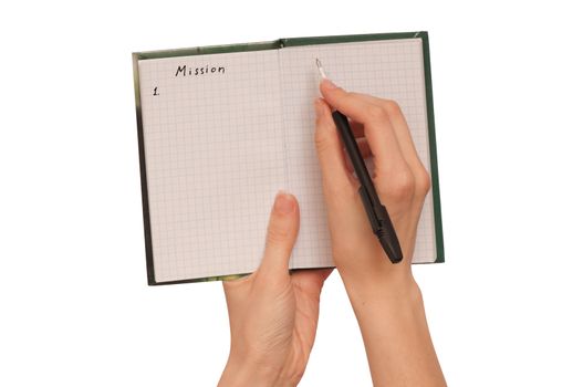 business woman writes mission for business plan