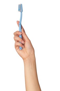 brush for toothpaste at in the girl's hand