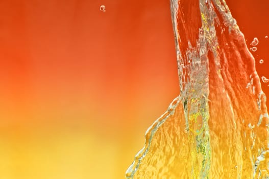splash fresh tropical sea water in a glass aquarium with red lamp