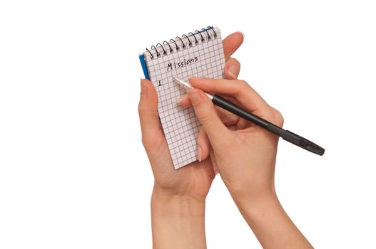 business woman writes mission for business plan