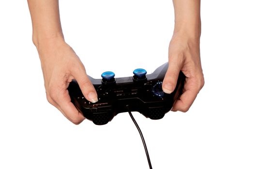 The girl plays a computer game with the help joypad