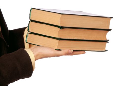 The woman in a business suit, shows old business books for notes