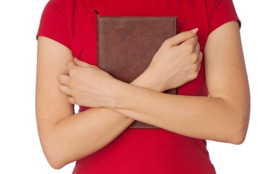 The woman holds the business book for notes