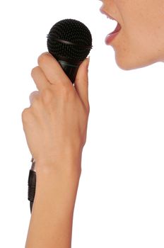 The singer sings a song in a microphone