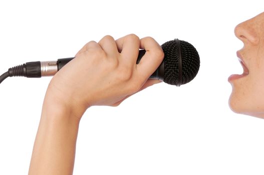 The singer sings a song in a microphone