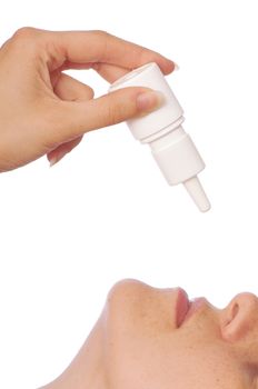 The woman drips drops for a nose for fast recover