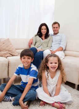 Cheerful family sitting in the living room
