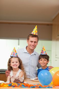 Smiling father celebrating with his kids