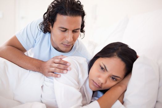 Young man trying to calm down his girlfriend