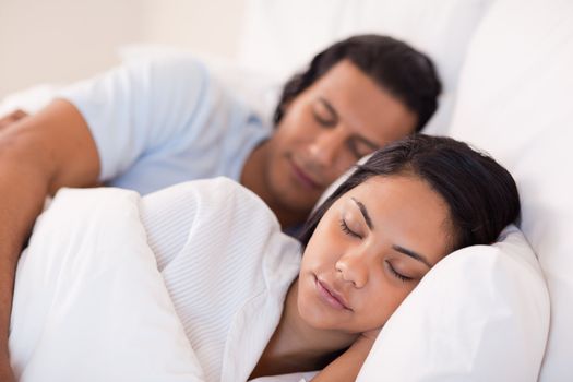 Side view of young couple being asleep