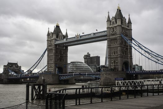 View of the Tower Bridge, London, an iconic landmark for the city, against a grey overcast winter sky