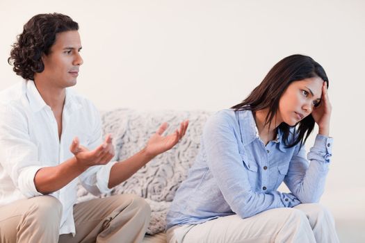 Young male trying to apologize to his girlfriend