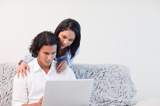 Young couple using the internet together