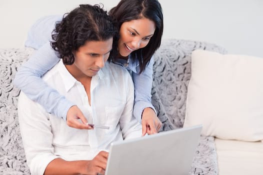 Young couple booking vacations online
