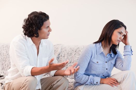 Young man trying to apologize to his girlfriend