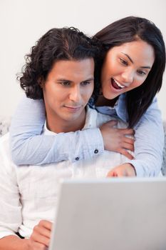 Young couple spending time online together