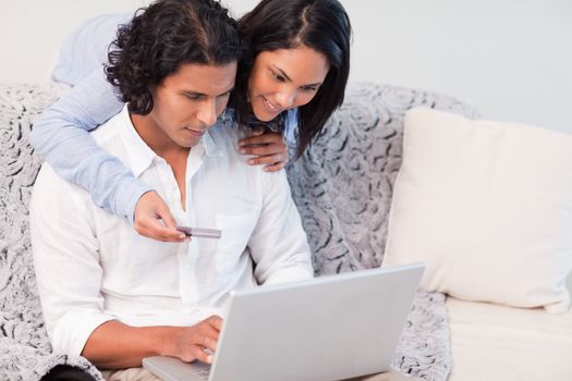Young couple booking holidays online