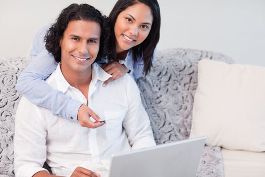 Young couple shopping online together