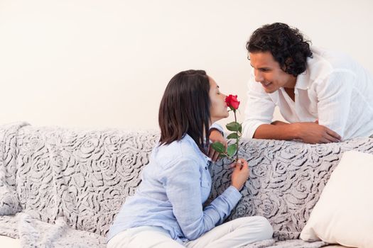 Young couple celebrating valentines day in the living room
