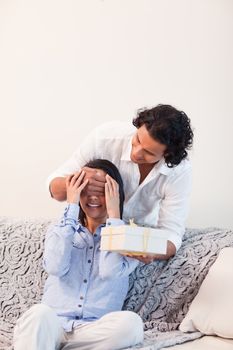 Young man having a surprise for his girlfriend