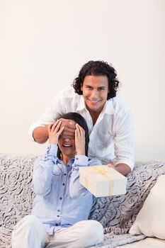 Young man having a little surprise for his girlfriend