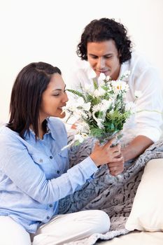 Young boyfriend getting a bouquet by her boyfriend