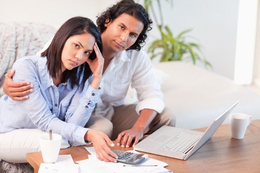 Young couple having a hard time paying their bills