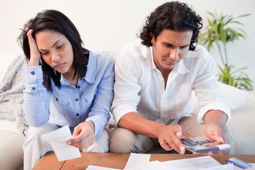Young couple having a hard time doing their finances