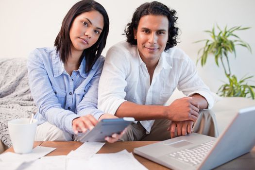 Young couple paying their bills online