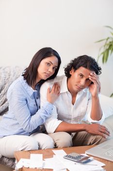 Young couple frustrated over their financial situation