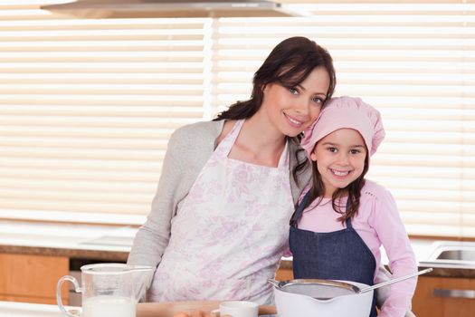 Mother and daughter baking in a kitchen