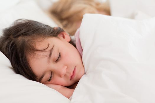 Calm children sleeping in a bedroom