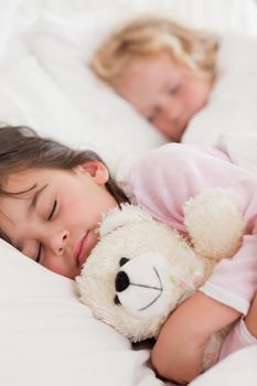 Portrait of calm children sleeping in a bedroom