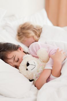 Portrait of children sleeping in a bedroom