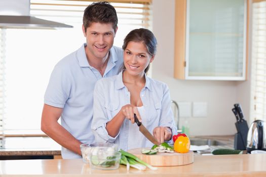 Couple cooking together in their kitchen