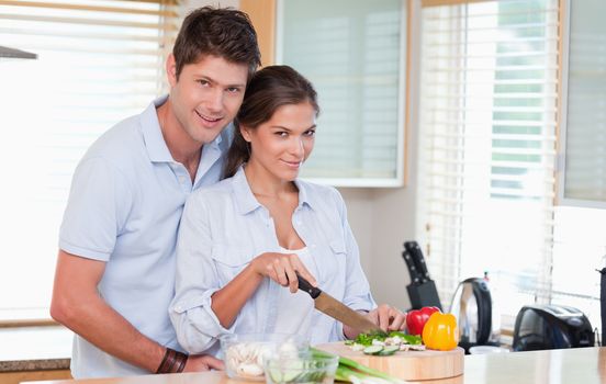 Married couple cooking in their kitchen