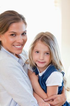 Portrait of a young mother and her daughter posing together
