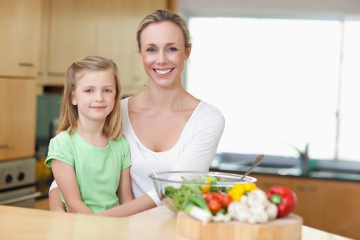Mother and daughter in the kitchen together
