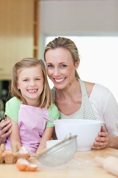 Mother and daughter having a good time in the kitchen