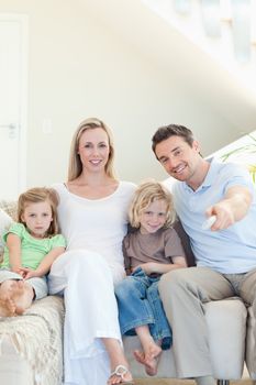 Family enjoying a movie together