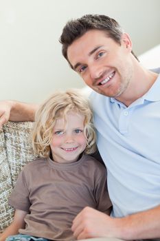 Father and son sitting on the sofa