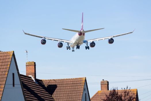 HEATHROW AIRPORT, LONDON - 9 SEPTEMBER: VIrgin Atlantic A340 approaches Heathrow on 9 September 2012. London Heathrow is the third busiest airport in the world.