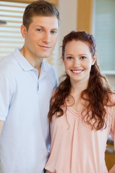 Couple standing in the kitchen together