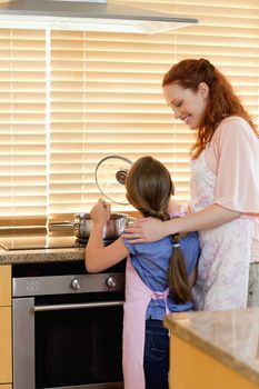Mother and daughter preparing a meal together