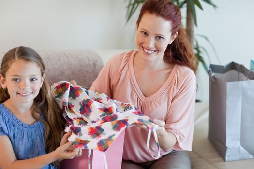Mother and daughter on the sofa with their shopping
