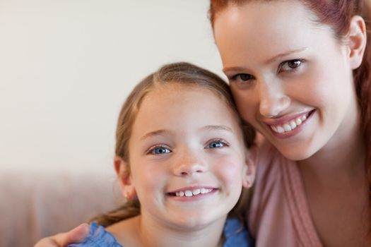 Cheerful smiling mother and daughter