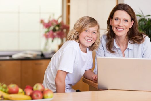 Woman with her son on the laptop